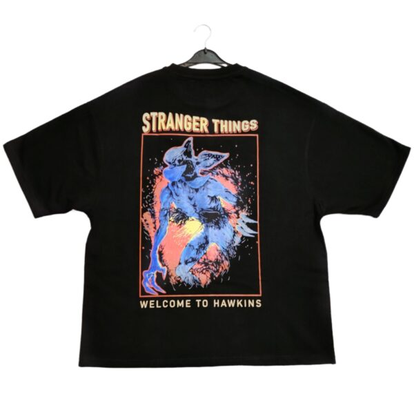 Vivid black Stranger Things graphic T-shirt featuring a Demogorgon creature with the text "Welcome to Hawkins," perfect for fans of the Netflix series and horror-themed fashion.
